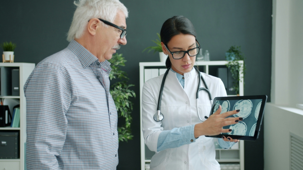 Medical imaging storage - doctor showing MRI image to patient