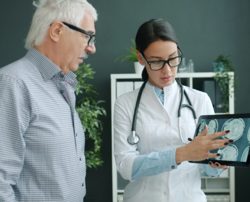 Medical imaging storage - doctor showing MRI image to patient
